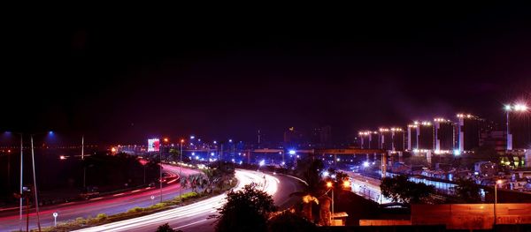 High angle view of light trails on road at night