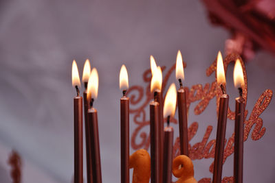 Close-up of lit candles 