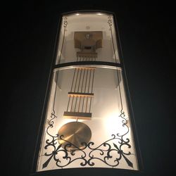 Low angle view of illuminated lamp on building