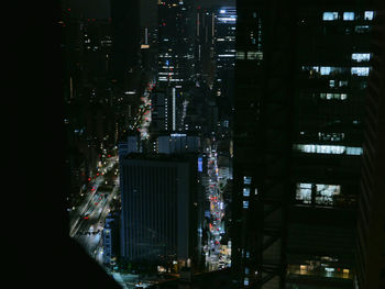 Illuminated modern buildings in city at night