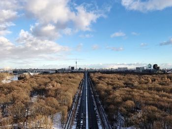 Train on railroad track against sky