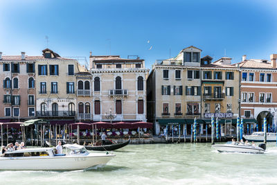 Boats moored at waterfront