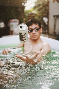 Portrait of shirtless man in water