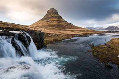 The kirkjufell mountain and the kirkjufellfoss waterfall at grundarfjordur in iceland