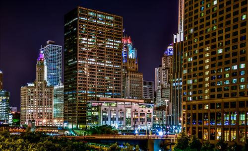 Low angle view of modern buildings at night