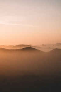 Scenic view of landscape against sky during sunset