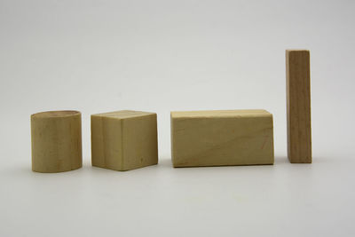 Close-up of toys on table against white background