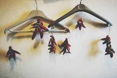 Close-up of toys hanging against wall