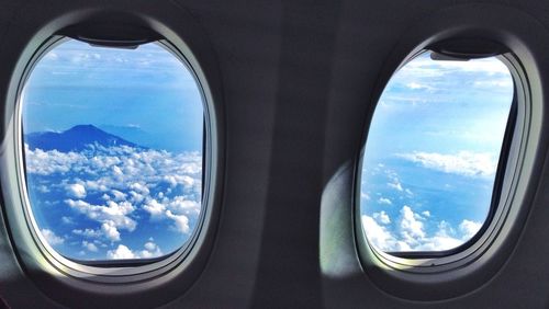 Cloudy sky seen through airplane window