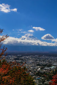 Aerial view of townscape against sky