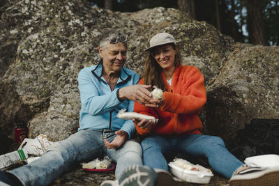 Smiling couple having picnic