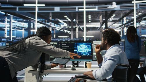 Rear view of woman sitting in city