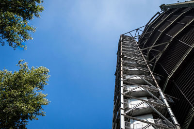 Low angle view of tower against blue sky. gasometer, oberhausen, germany