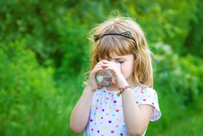 Girl drinking water from glass