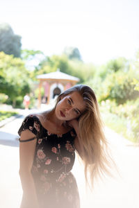 Portrait of woman standing outdoors