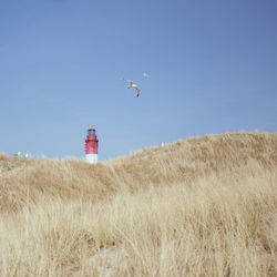 Lighthouse against blue sky