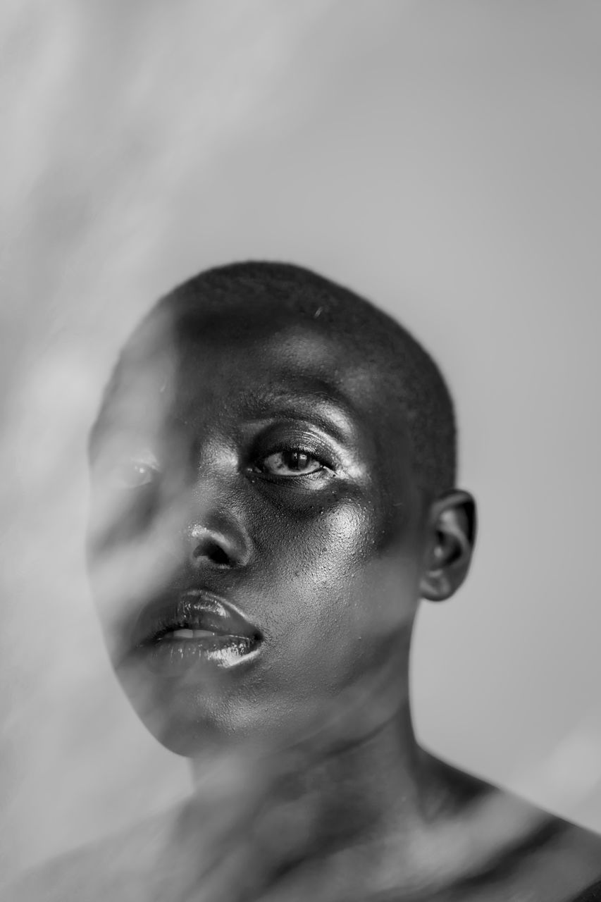 headshot, portrait, one person, indoors, close-up, young adult, looking, looking away, lifestyles, real people, front view, studio shot, focus on foreground, adult, young women, leisure activity, emotion, contemplation, human face, hairstyle