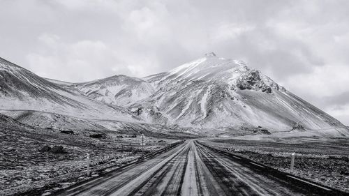 Panoramic view of snowcapped mountains against sky