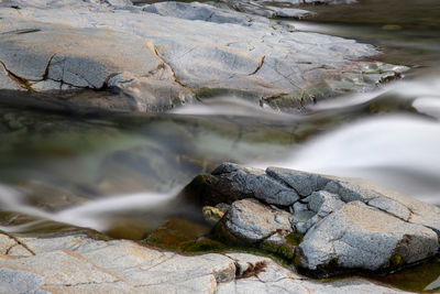 Close-up of rocks in river