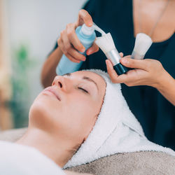 Close-up of woman getting massage therapy at spa