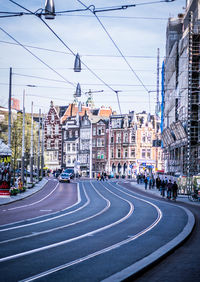 Amsterdam city street and buildings against sky