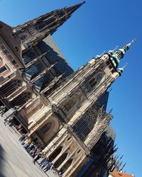 Low angle view of statue against blue sky