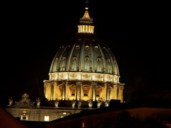 Low angle view of illuminated cathedral against sky at night