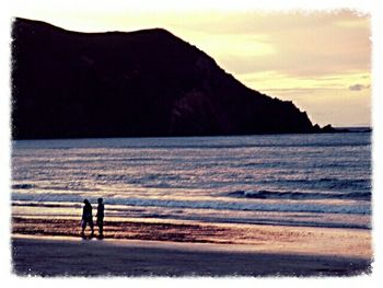 Scenic view of sea at sunset