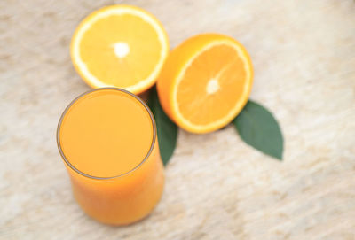 High angle view of orange juice on table