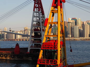 Construction site in city against clear sky