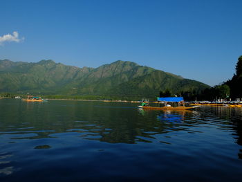 Scenic view of lake against blue sky