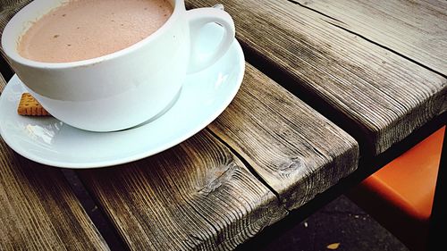 High angle view of coffee cup on table