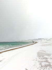 Scenic view of beach against clear sky