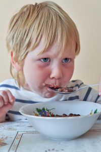 Portrait of cute baby girl in bowl