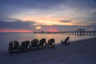 Scenic view of beach against sky during sunset