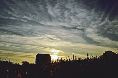 Scenic view of landscape against cloudy sky