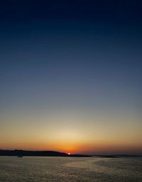 Scenic view of sea against clear sky during sunset