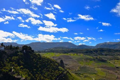 Scenic view of agricultural landscape against sky