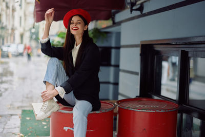 Portrait of young woman standing in office