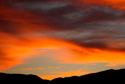 Low angle view of dramatic sky during sunset