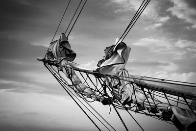 Low angle view of tall ship mast against sky