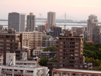 Buildings in city against sky