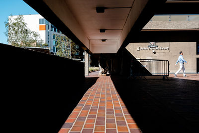 People walking amidst buildings in city