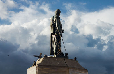 Low angle view of statue against sky