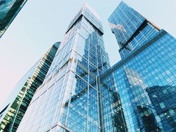 Low angle view of modern buildings against clear sky