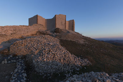 View of castle against clear blue sky