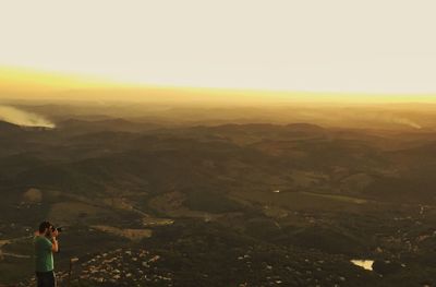 Scenic view of landscape against sky during sunset