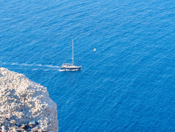 High angle view of sailboat sailing in sea