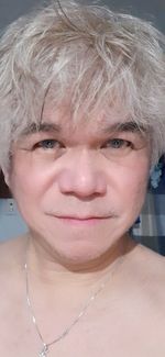 Close-up portrait of a smiling young woman