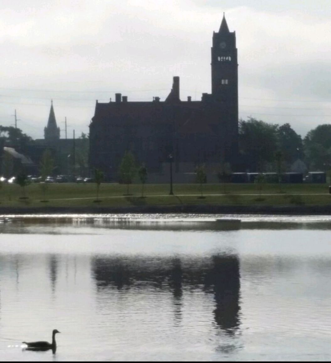 REFLECTION OF BUILDING IN WATER